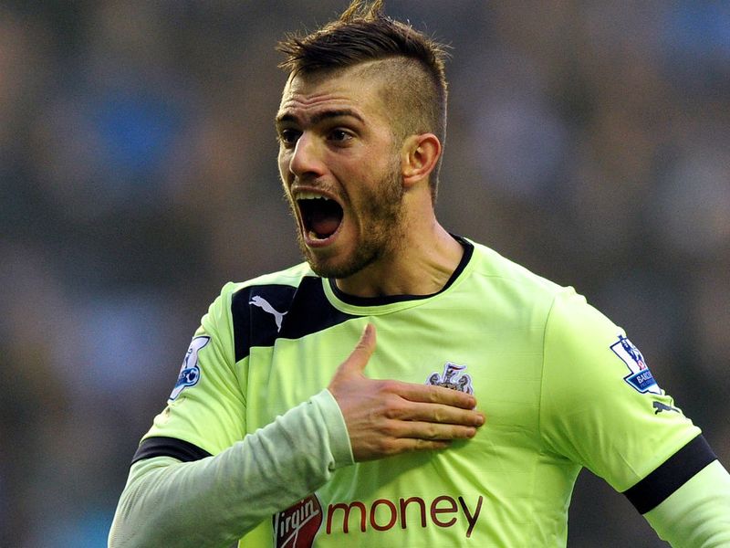 United's Italian defender Davide Santon celebrates scoring the equalising goal