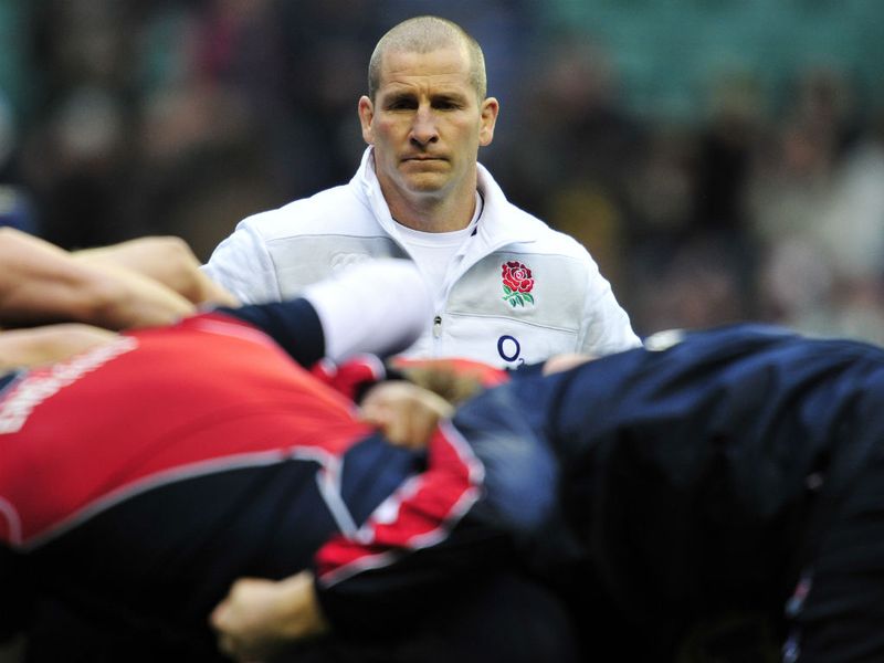 Watchful eye: England's head coach Stuart Lancaster leads his team's warm-up before the start