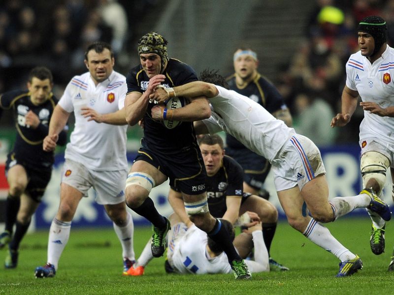 Rampaging run: Kelly Brown sets off on a powerful burst