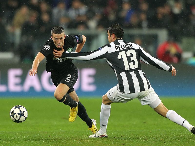 Adam Matthews is held back by Federico Peluso
