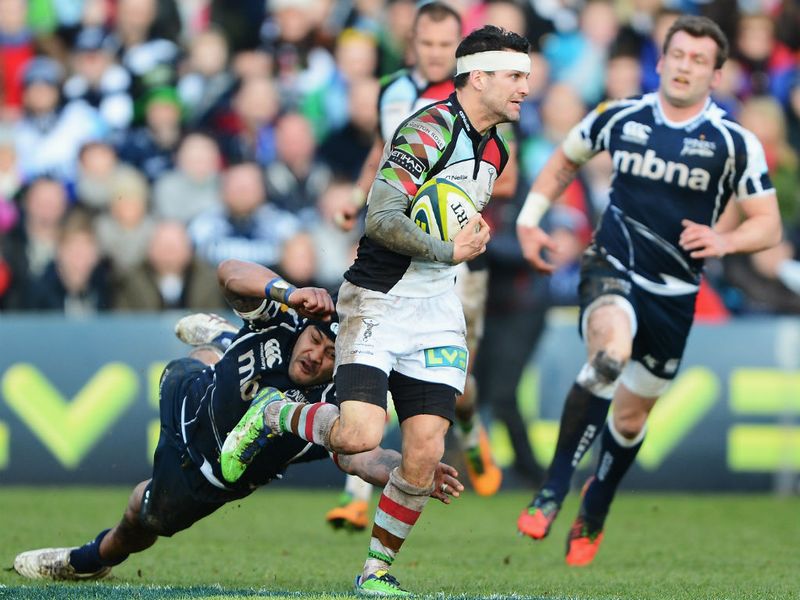 Full stretch: Sammy Tuitupou of Sale Sharks dives to tackle Karl Dickson