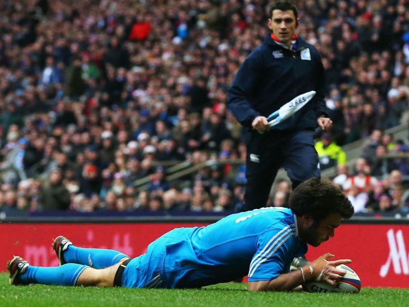 Crucial touchdown: Luke McLean of Italy goes over to score the game's only try...