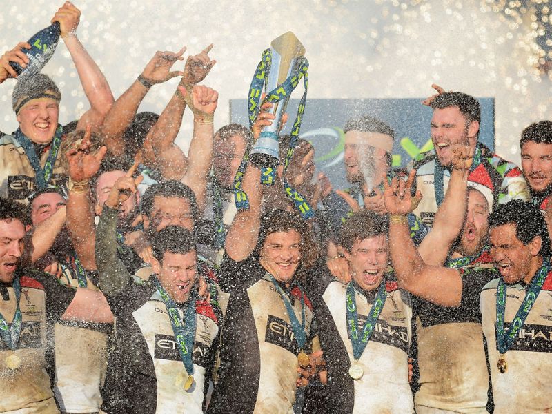 Winning feeling: Harlequins captain Luke Wallace lifts the trophy following his team's victory over Sale Sharks