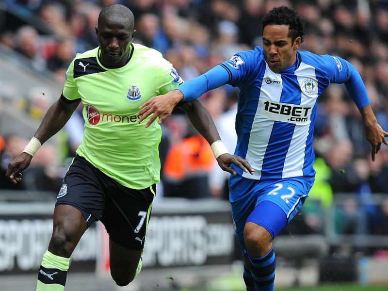 Moussa Sissoko is in a race with Jean Beausejour at the DW Stadium