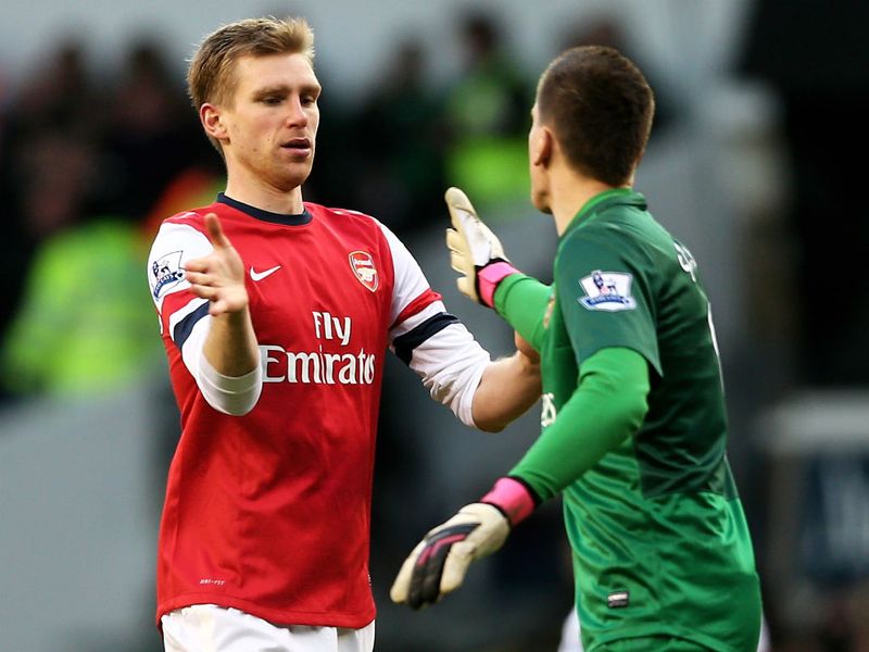 The German gets a high five from goalkeeper Wojciech Szczesny