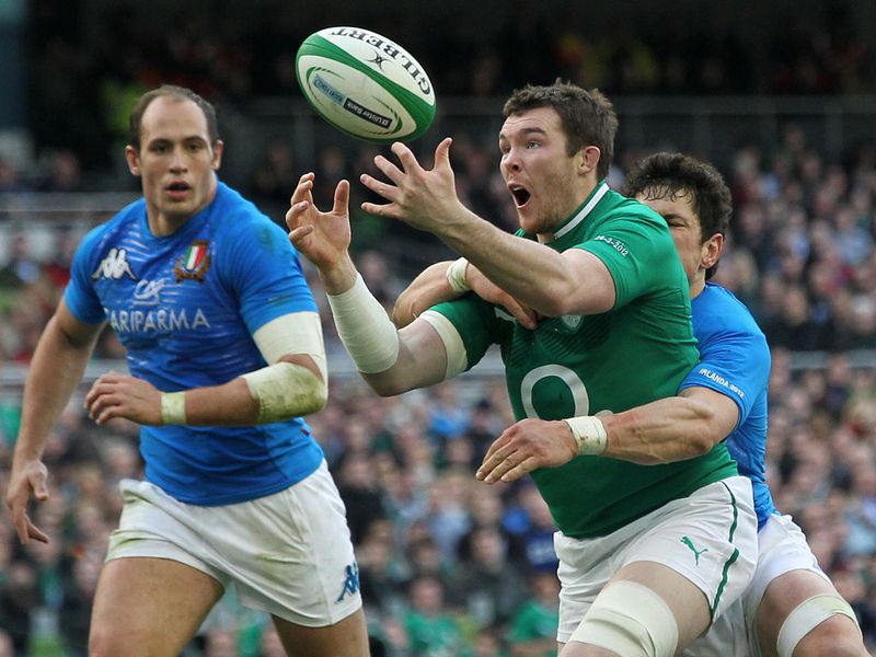 Fully focused: Peter O'Mahony of Ireland is tackled by Italy's Andrea Masi