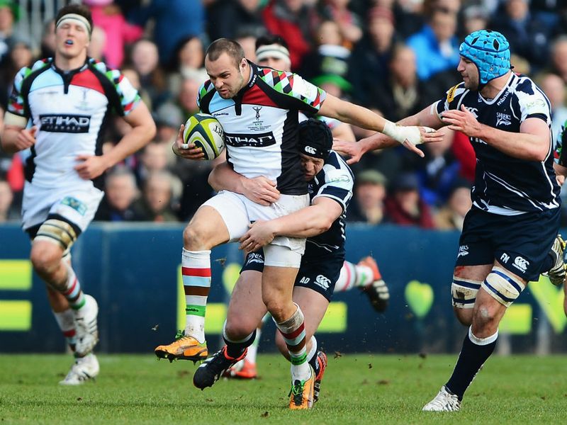 Giving their all: Ross Chisholm is tackled by Alasdair Dickinson