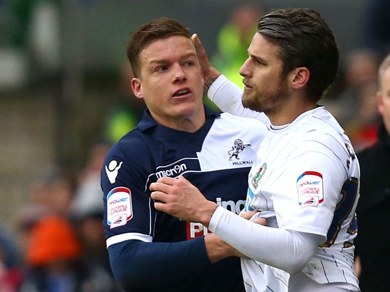 David Bentley and Shane Lowry square up as the games ends goalless