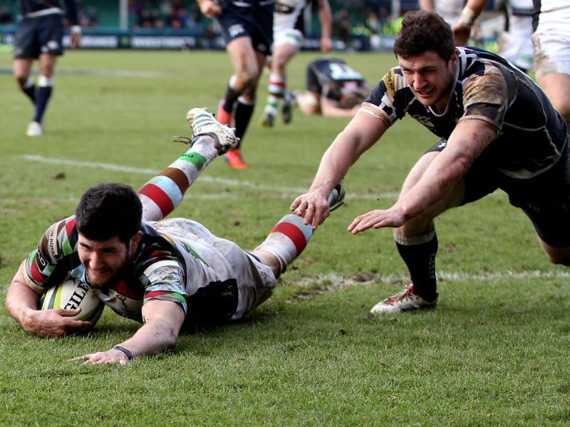 Crucial score: Tom Casson notches the vital third try to further increase Harlequins' advantage