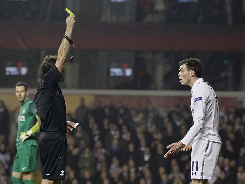 Bale is booked by referee Antonio Mateu Lahoz for diving, the Welshman will now miss the second leg in Milan next week
