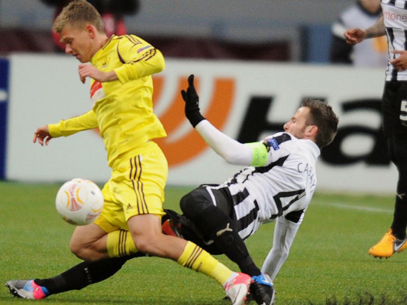 Yohan Cabaye tackles Oleg Shatov during the first half at the Luzhniki Stadium in Moscow.