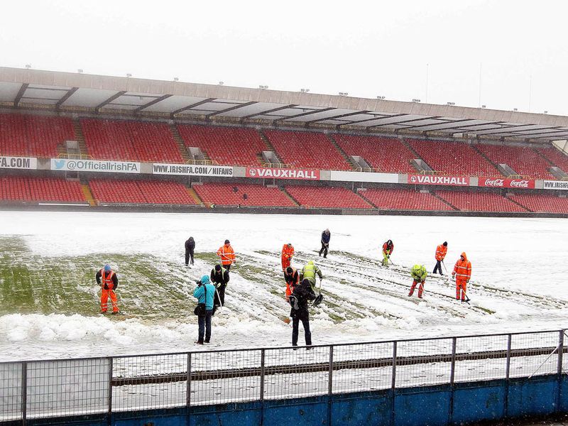 Heavy snow in Belfast has seen Northern Ireland's clash with Russia postponed until Saturday.