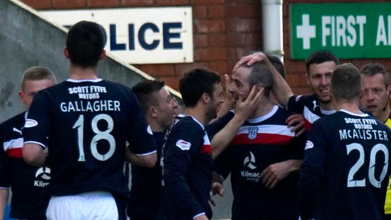 Gary Harkins: Congratulated by his Dundee team-mates