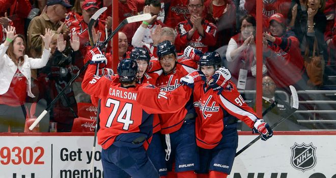 Alex Ovechkin is mobbed after his goal for the Washington Capitals
