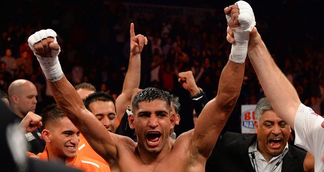 Khan celebrates a points decision which is thought to have put him in a position to challenge for titles