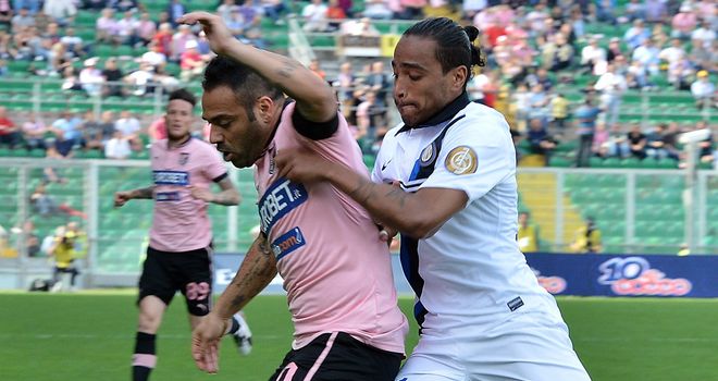 Fabrizio Miccoli and Alvaro Pereira battle for the ball