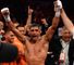 Khan celebrates a points decision which is thought to have put him in a position to challenge for titles