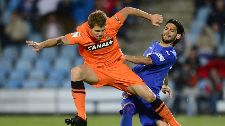 Angel Imanol Lafita vies with Inigo Martinez.