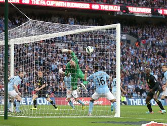 Ben Watson heads home Wigan's late winner at Wembley