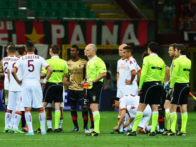 Play is briefly suspended at the San Siro