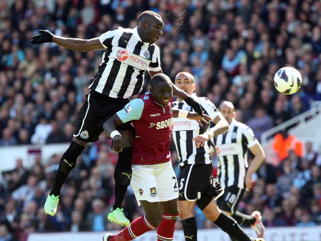 Cheick Tiote rises above Mohamed Diame.