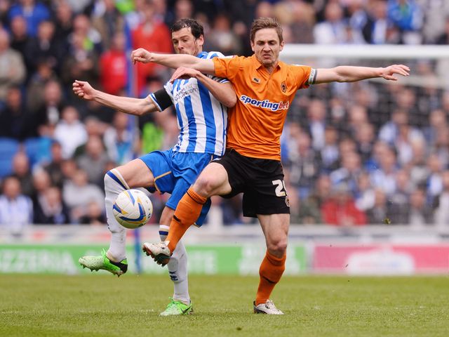 Gordon Greer battles with Kevin Doyle.
