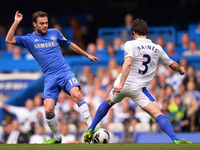 Leighton Baines and Juan Mata battle for the ball