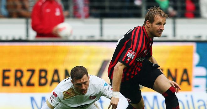 Stefan Aigner of Frankfurt is challenged by Oliver Fink