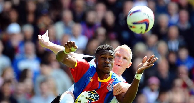 Wilfried Zaha: Holds off Peterborough's Craig Alcock
