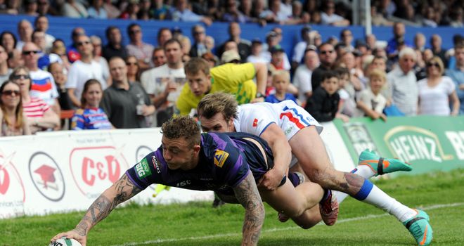 Josh Charnley touches down the first of his three tries in Wigan's win at Wakefield