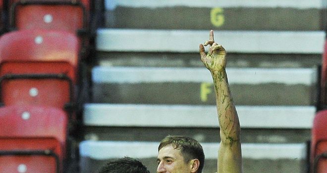 James Clare (right): four tries in defeat for the Tigers