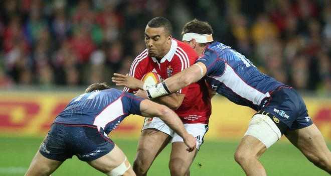 Simon Zebo is tackled by Mitch Inman and Lachlan Mitchell