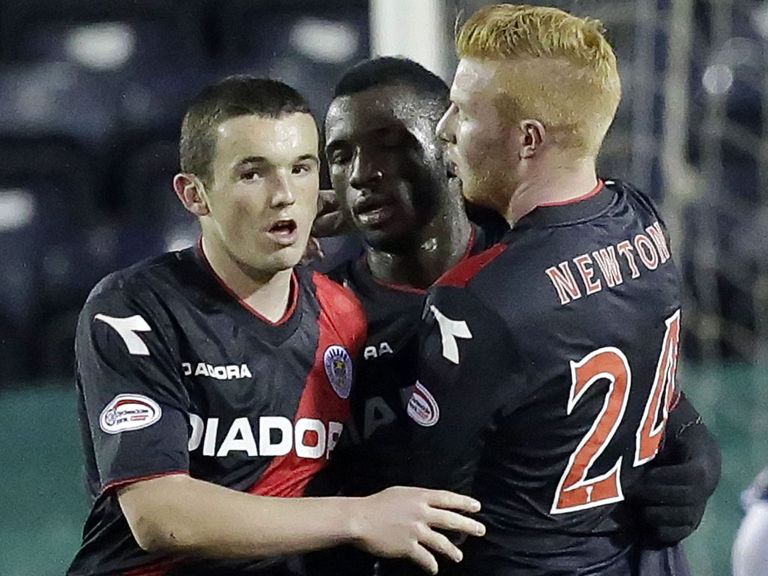 Conor Newton (R) celebrates a St Mirren goal with Esmael Goncalves and John McGinn