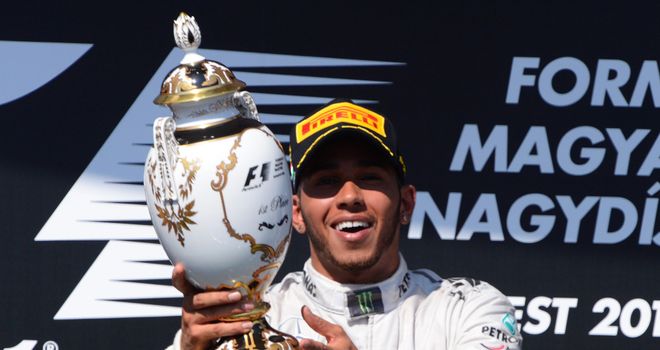 Lewis Hamilton: Celebrates on the podium after his maiden race win for Mercedes in Hungary