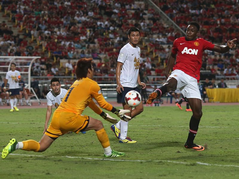 Danny Welbeck narrowly fails to get a toe to the ball ahead of the All-Stars goalkeeper