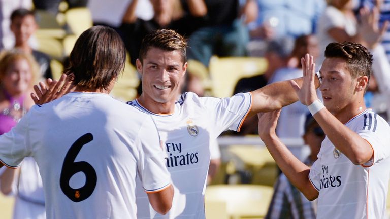 Cristiano Ronaldo celebrates his opener with Sami Khedira and Mesut Ozil