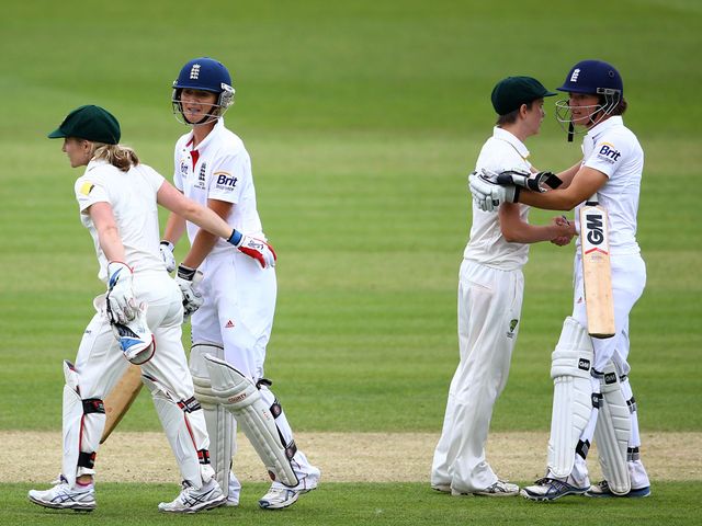 The players shake hands on a draw at Wormsley