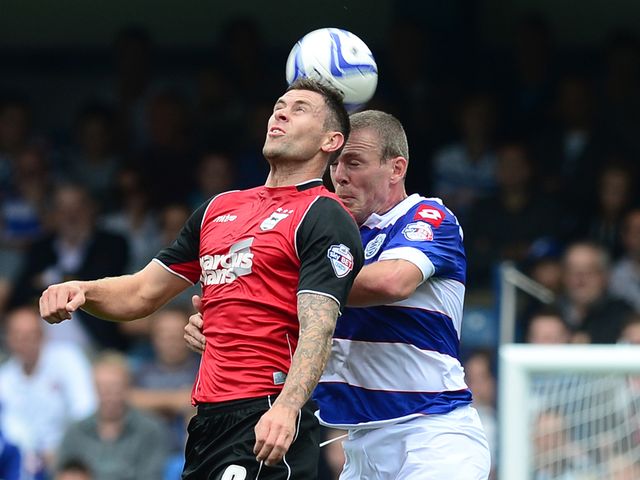 Richard Dunne and Daryl Murphy challenge for the ball