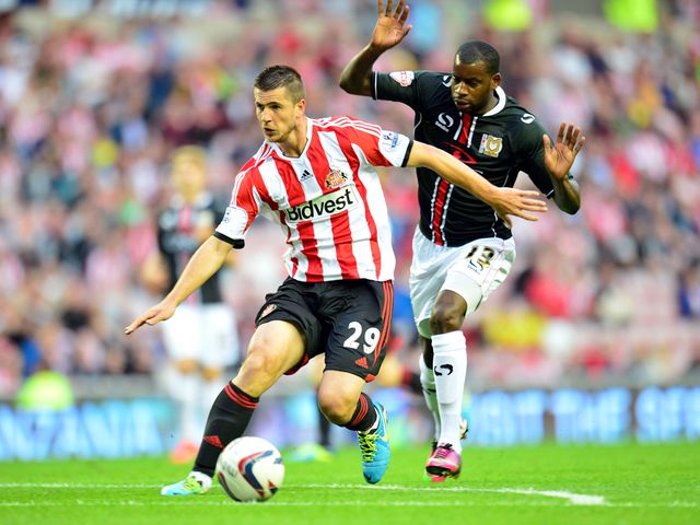 Valentin Roberge and Izale McLeod battle for the ball