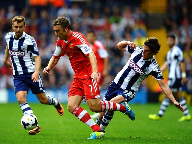 Rickie Lambert breaks away from Gareth McAuley