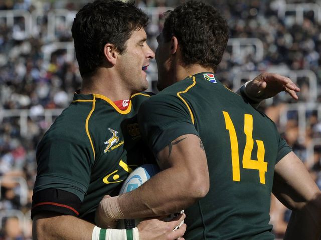 Morne Steyn celebrates with try-scorer Bjorn Basson (R)