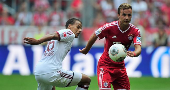 Bayern Munich's Mario Goetze gets past Timothy Chandler