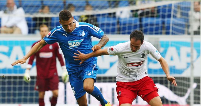 Fabian Johnson looks to get past Sebastian Freis