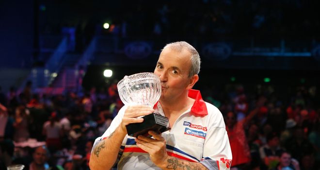 Phil Taylor with the Sydney trophy. Pic: Andrew Fawcett/PDC