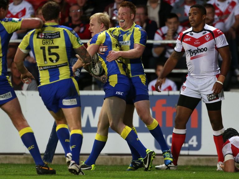 Rhys Evans celebrates a try in Warrington Wolves colours
