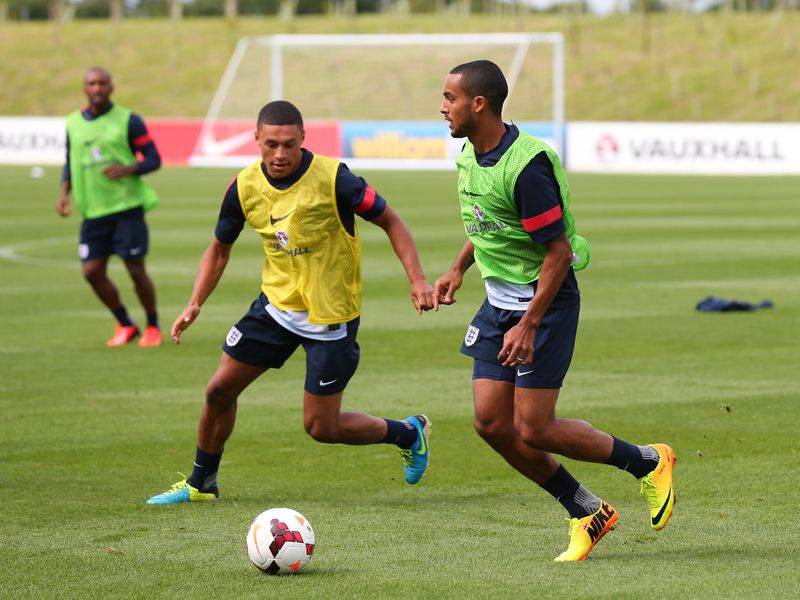 Theo Walcott takes on his Arsenal teammate Alex Oxlade-Chamberlain during the session.