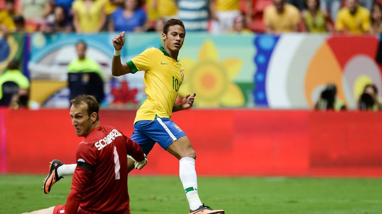 Neymar: Slides the ball past Australia keeper Mark Schwarzer