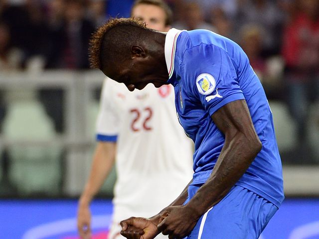 Mario Balotelli celebrates his goal for Italy