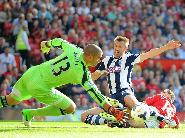 Boaz Myhill dives to save a shot from Javier Hernandez