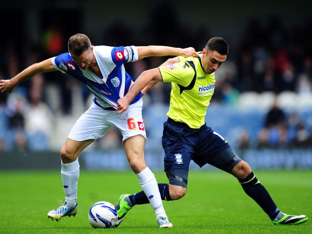 Clint Hill and Lee Novak compete for the ball